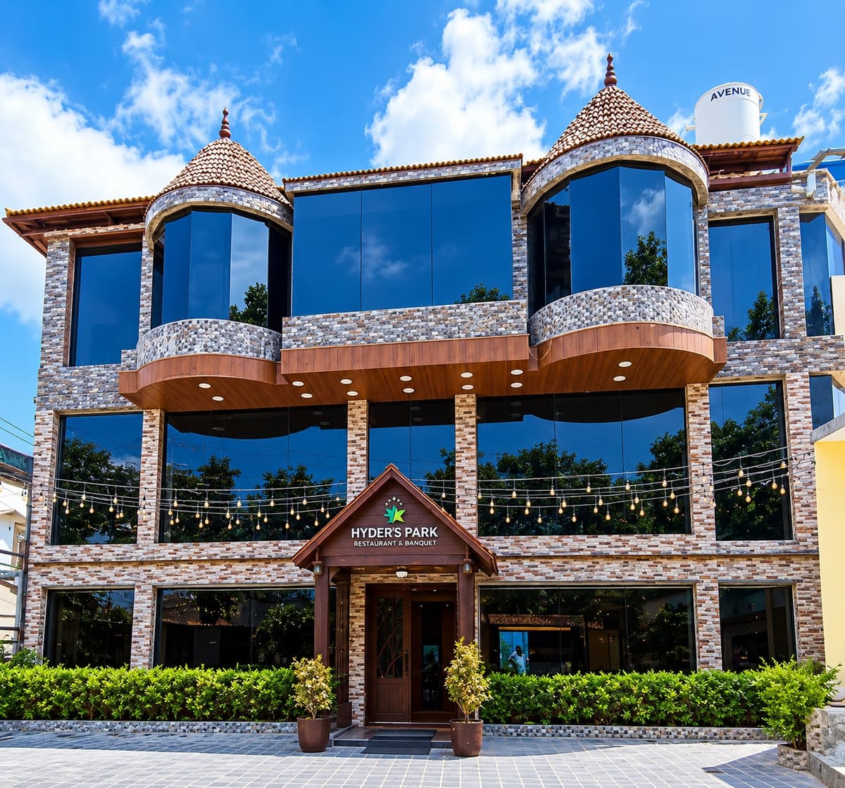 The Hyderspark building in Kodaikanal, with tiled turrets, tall glass windows and a timber entrance porch